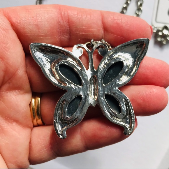 Elegant Silver Butterfly Necklace with Floral Details - Picture 7 of 11
